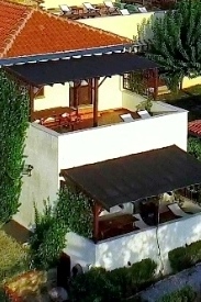 an outdoor dining area with barbeque (gas)